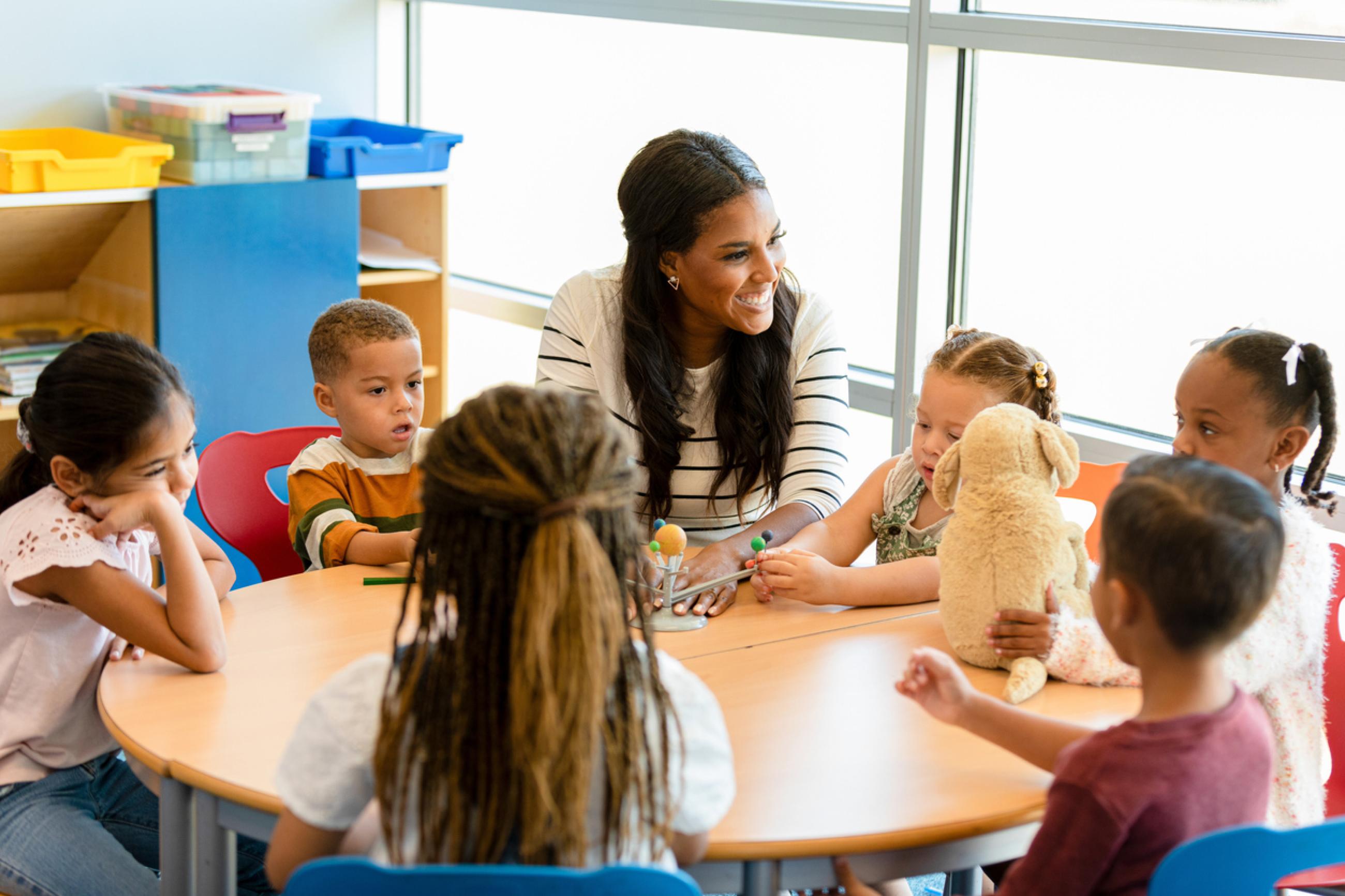 A teacher in a classroom with elementary school children