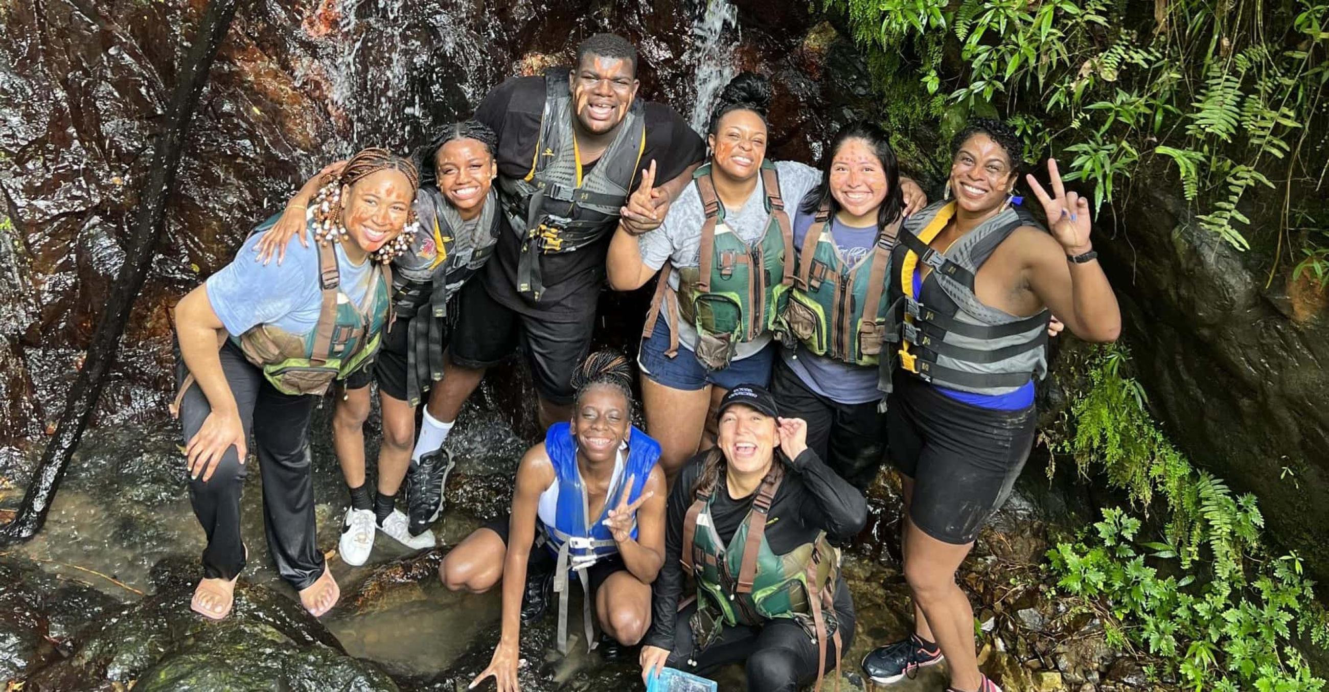 a group of UAP students, led by Dawn Stanton, exploring Río Arriba in Puerto Rico 