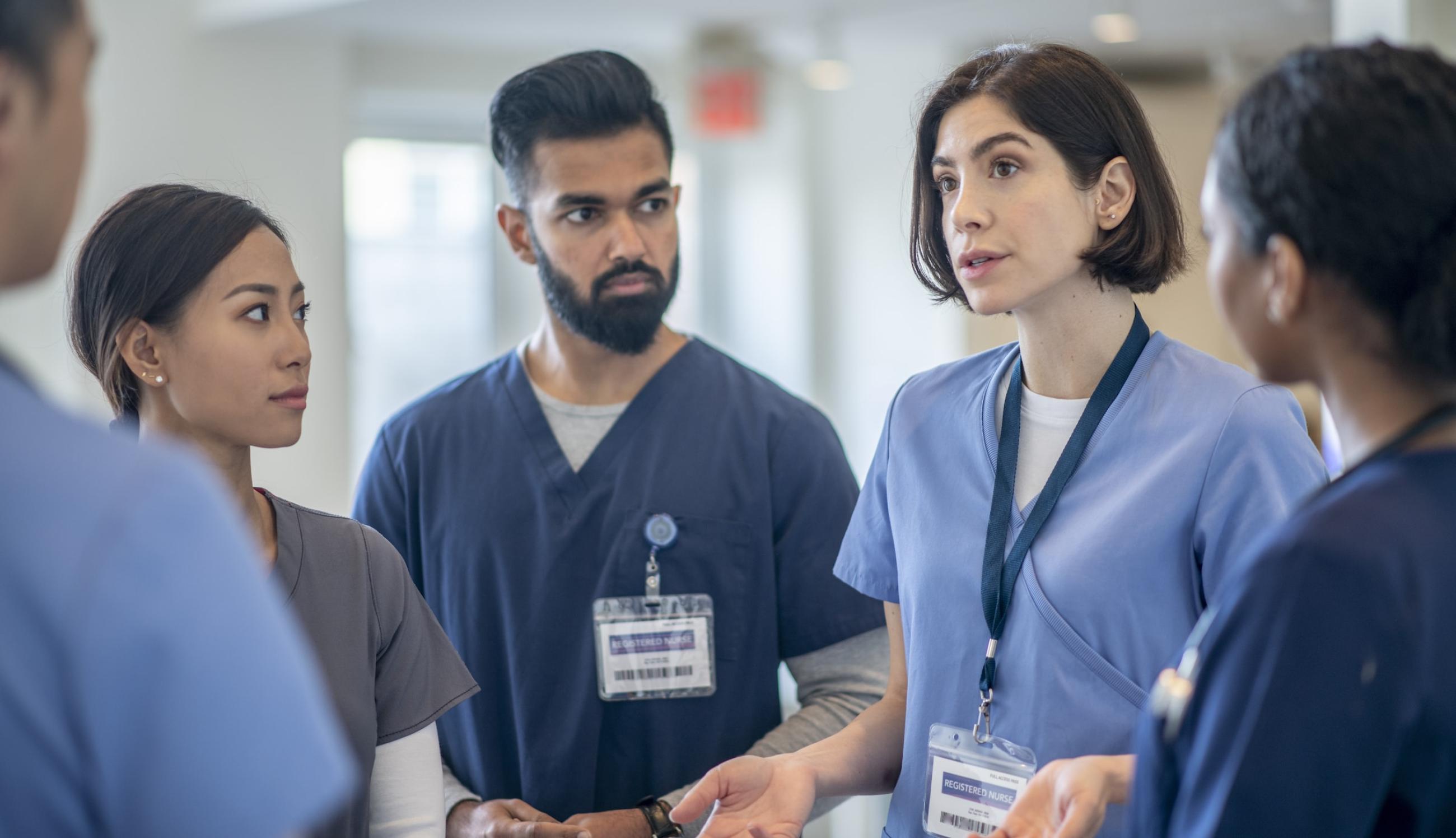 "A group of medical professionals in a hospital setting"