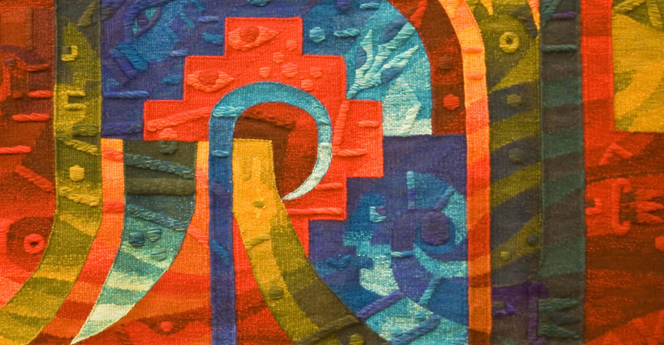 a closeup image of a colorful Native American woven fabric