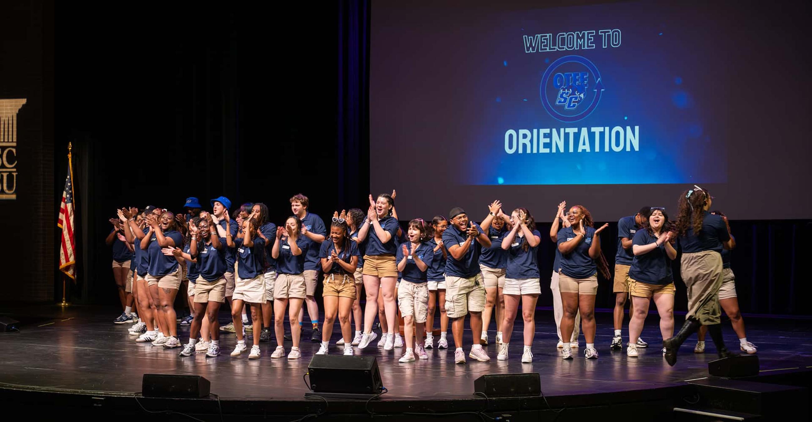 orientation ambassadors perform a skit on the Lyman Center stage