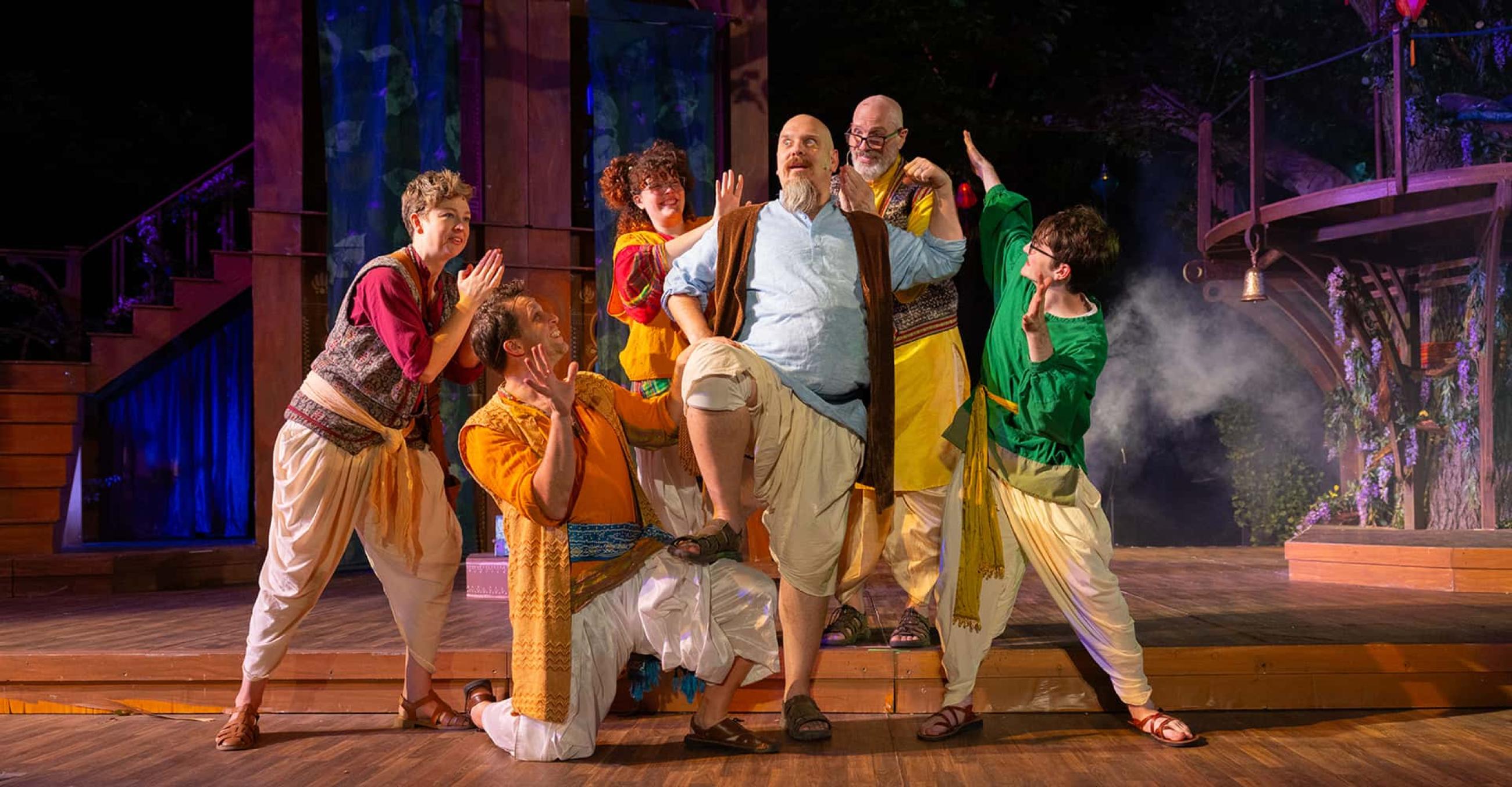 members of the cast of A Midsummer Night's Dream in a comic pose