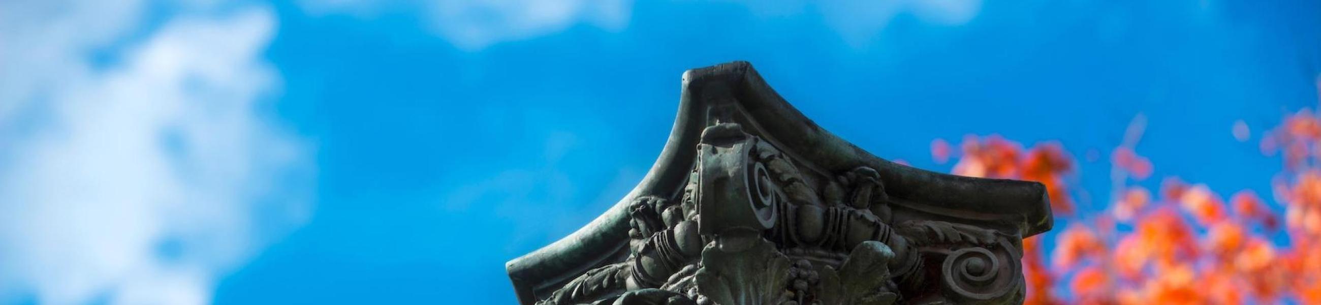 Column statue in front of the sky
