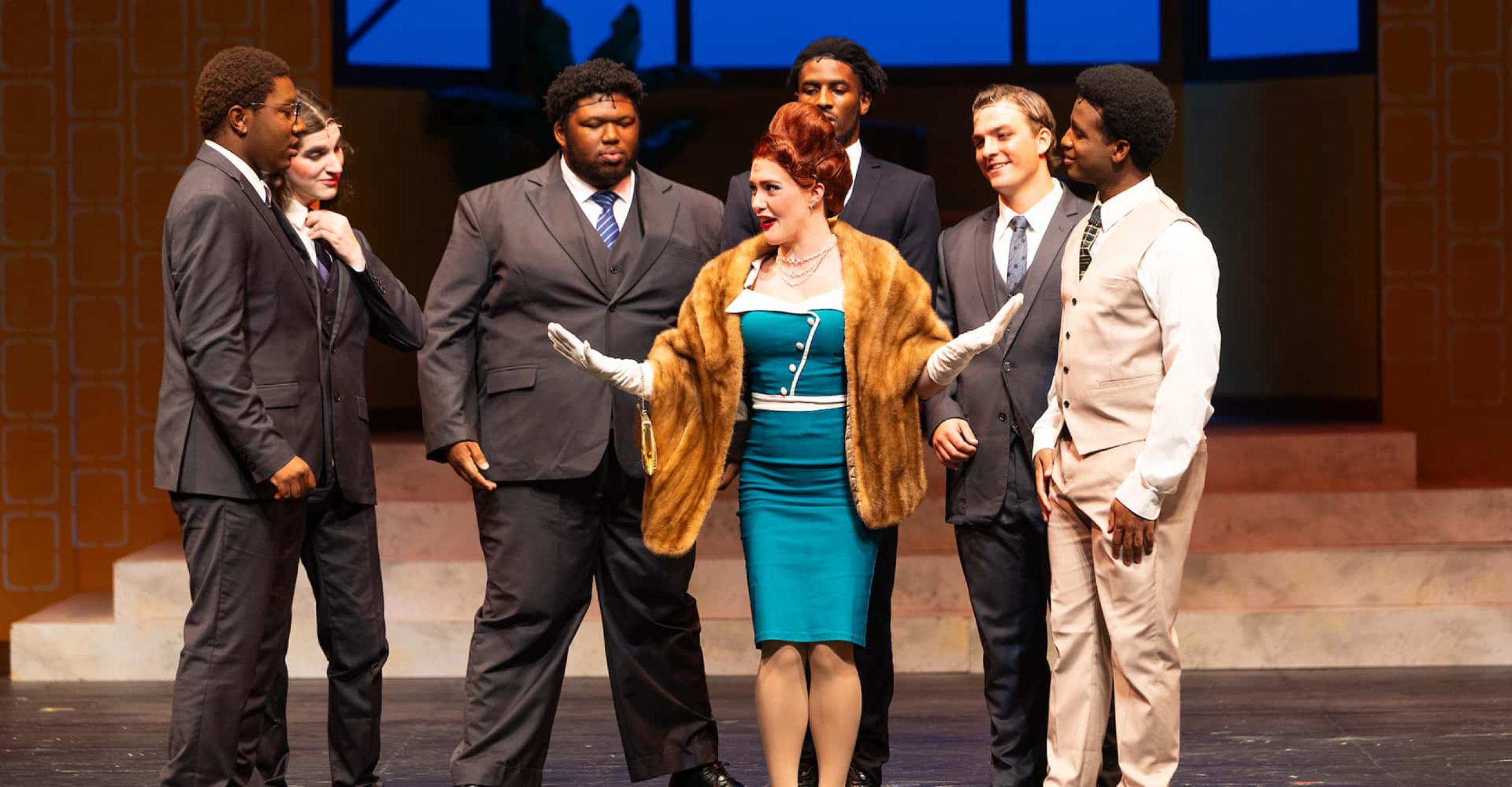 cast members in a scene from “How to Succeed in Business Without Really Trying” at SCSU's Lyman Center