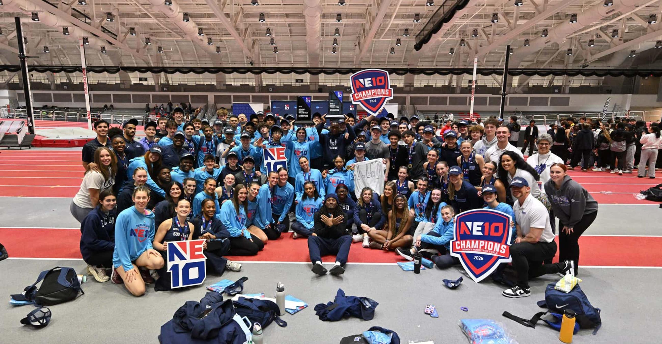 the SCSU men’s and women’s indoor track and field teams celebrate after winning the Northeast-10 Conference Championships 
