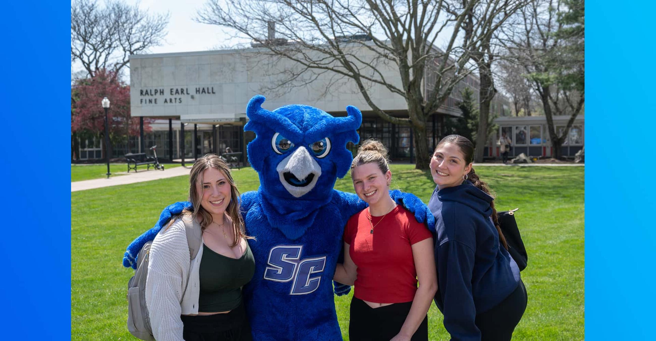 Students and Owl mascot at university quad