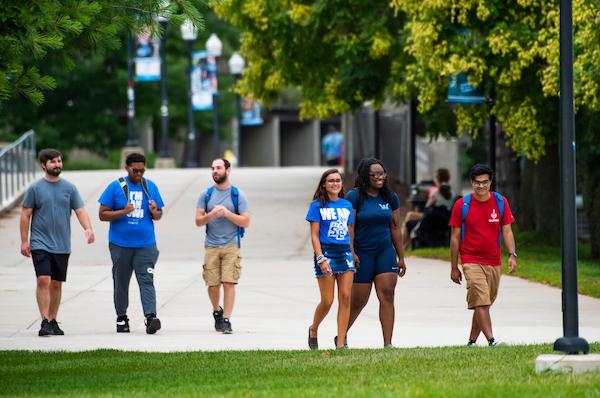 "A group of students waling across campus"