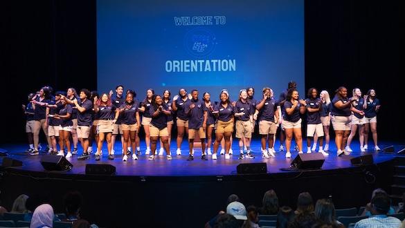 Orientation event with students on stage