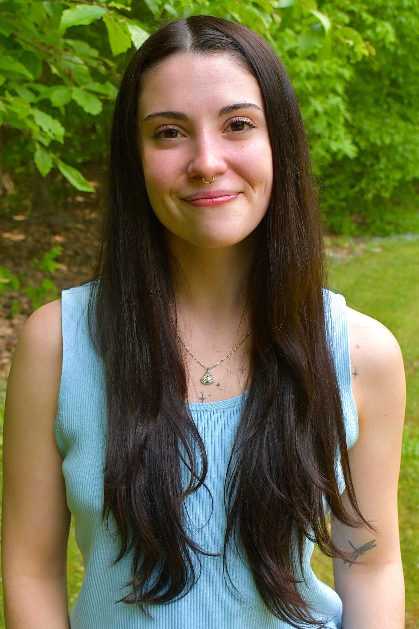headshot of Sarah Locascio a twenty something white lady with long brown hair
