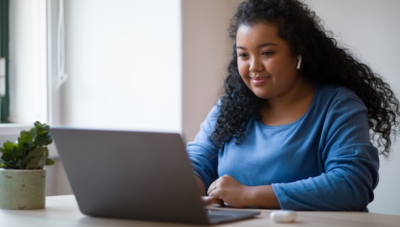 Young adult activating their MySCSU account on a computer